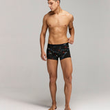 Front photo for a model wearing CottoSilk Galaxy Cotton Trunk in Black with smooth finish and space print.