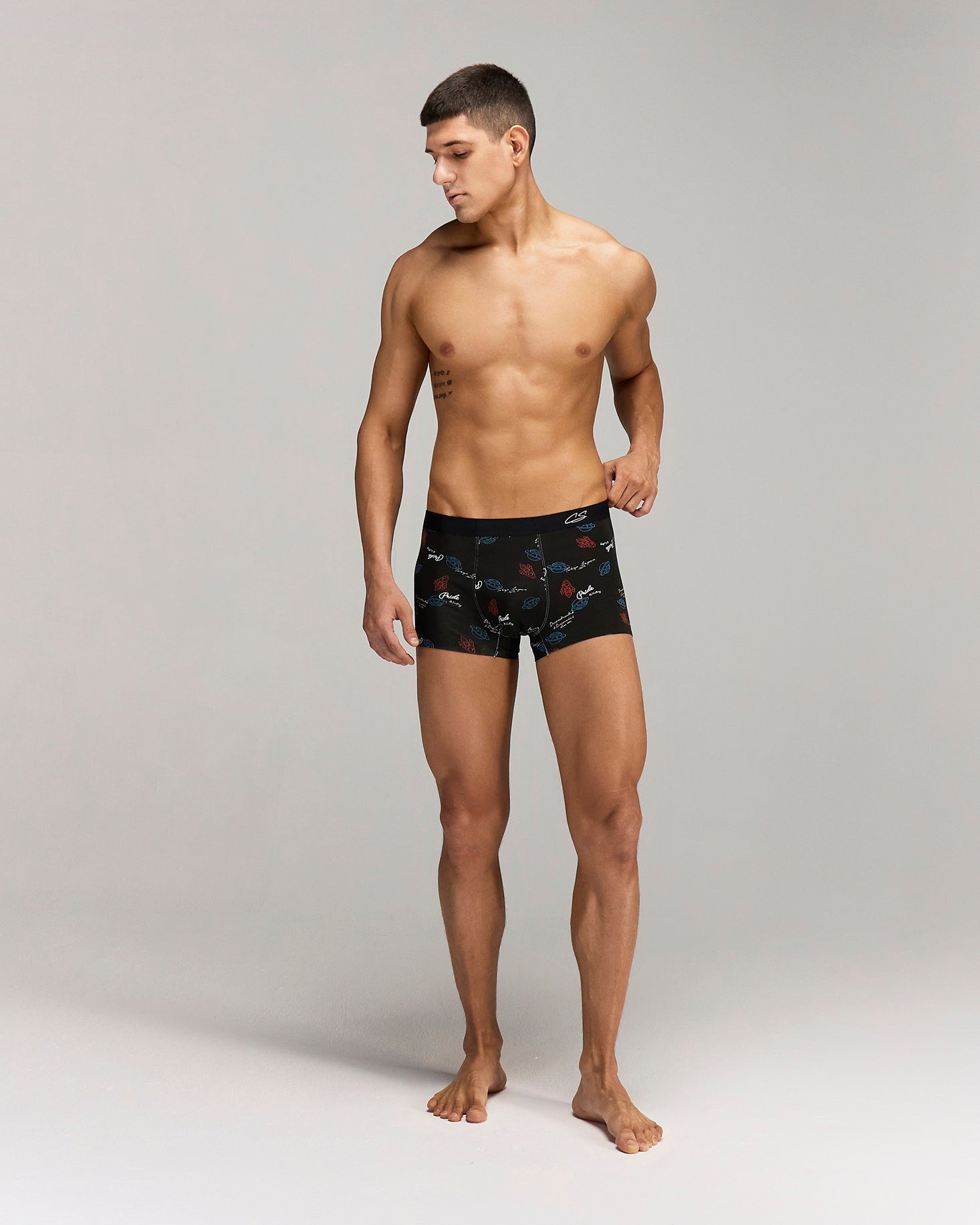 Front photo for a model wearing CottoSilk Galaxy Cotton Trunk in Black with smooth finish and space print.