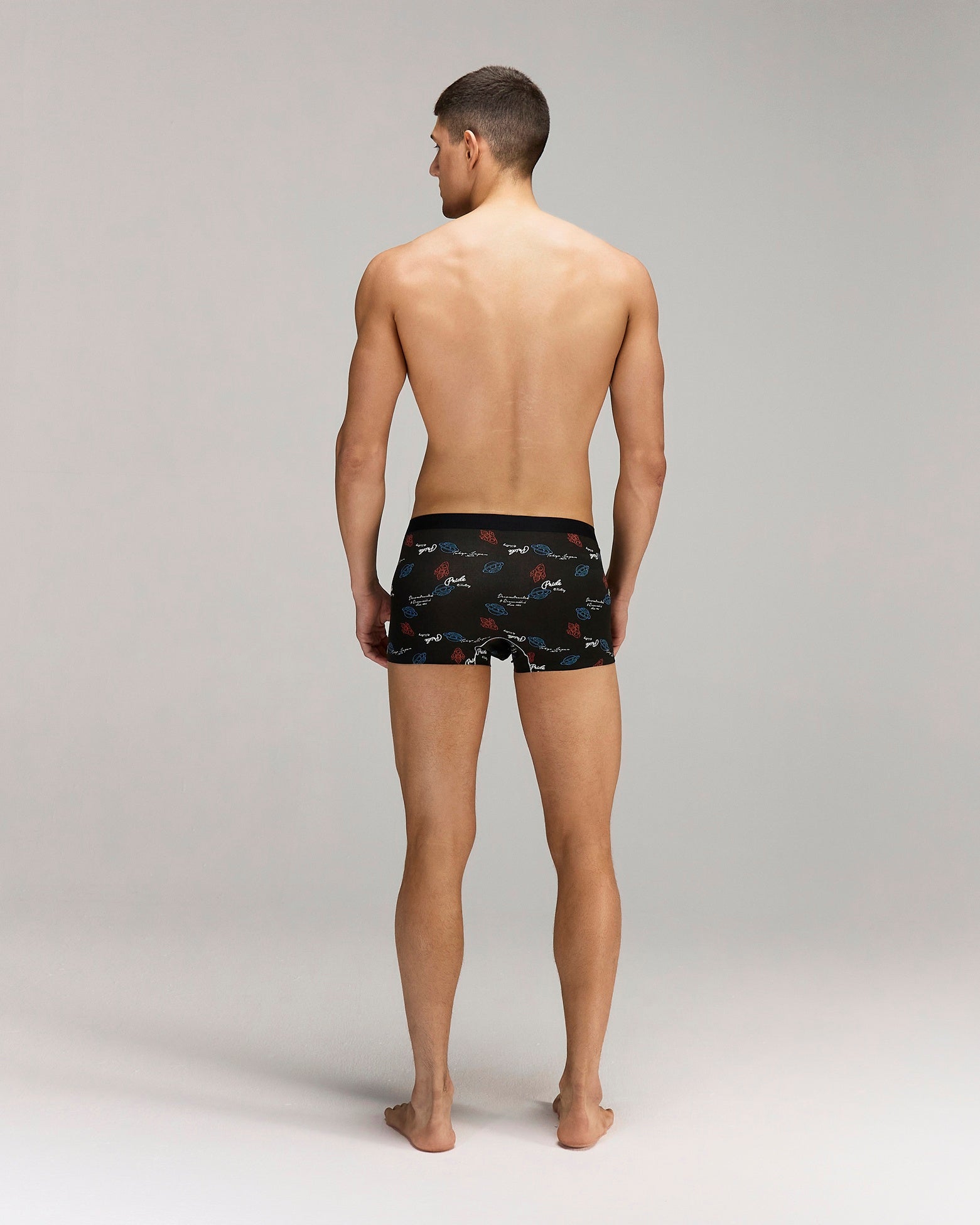 Back photo for a model wearing CottoSilk Galaxy Cotton Trunk in Black with smooth finish and space print.