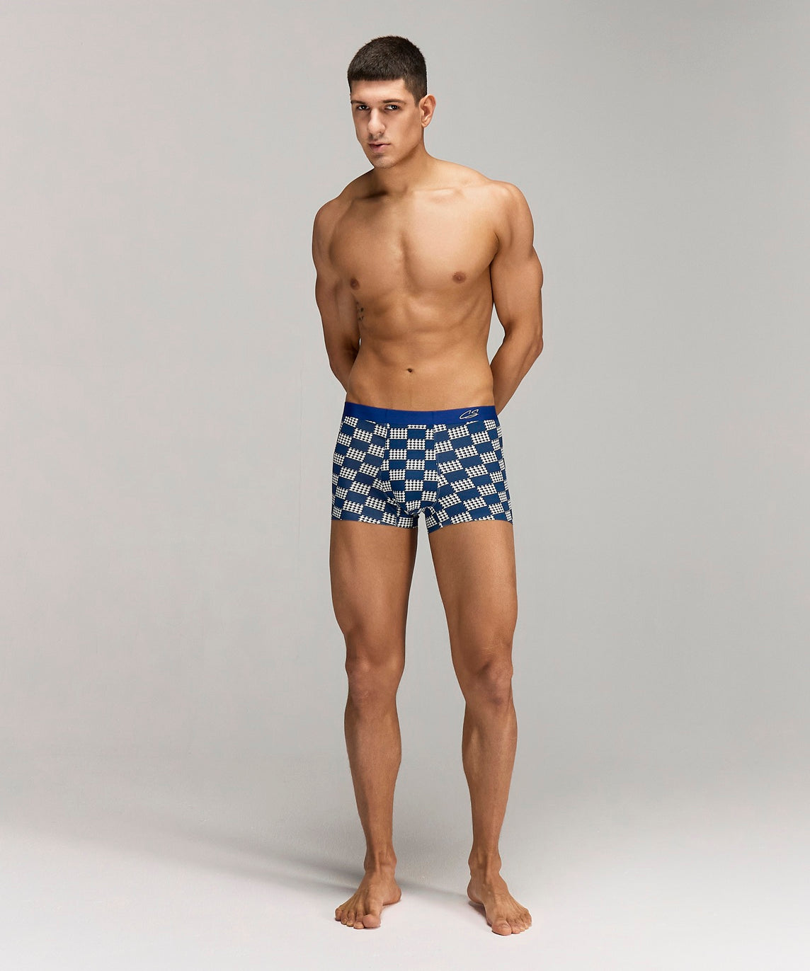 Front photo for a Model wearing Grid Modal Trunk with a geometric pattern in blue.