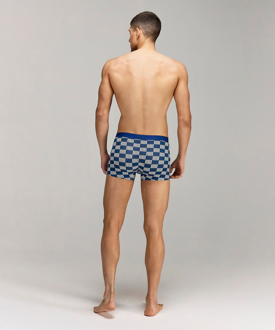 Back photo for a Model wearing Grid Modal Trunk with geometric pattern in blue.