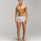 Front photo for a Model wearing Ultra Light Ice Tech Trunk in light jade.