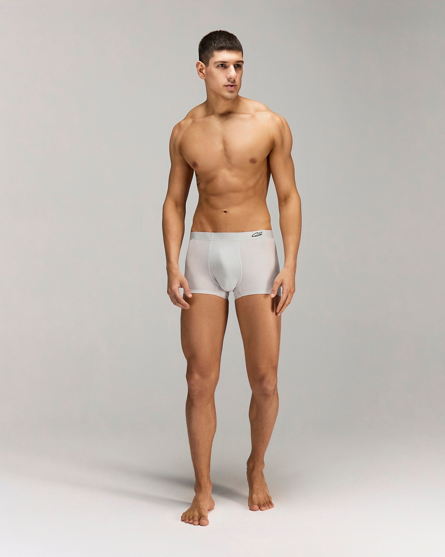 Front photo for a Model wearing Ultra Light Ice Tech Trunk in light jade.