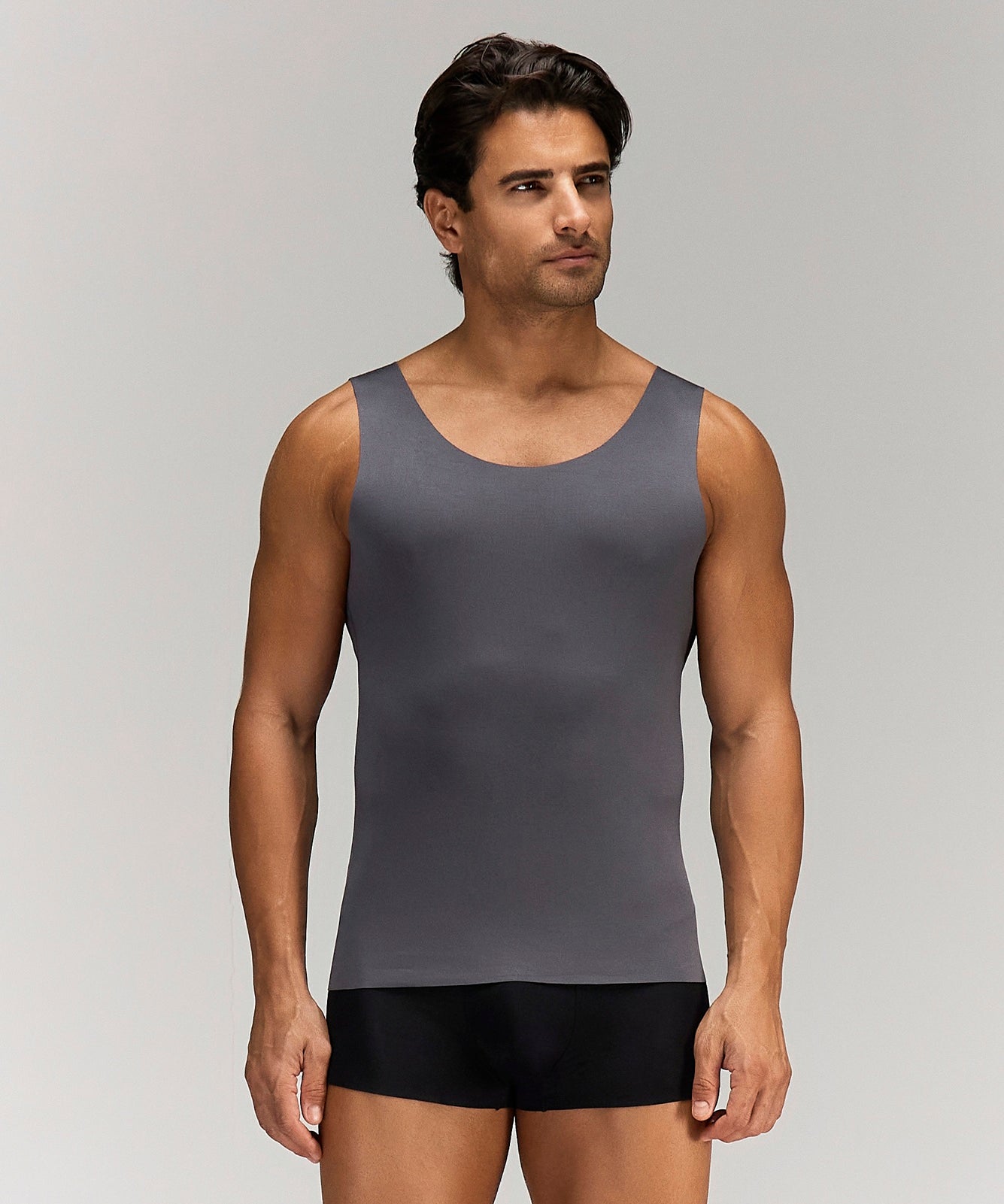 Front photo for a Model wearing Luxury Soft Modal Undershirt with V-neck in dark grey.