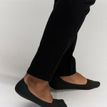 side photo of model wearing No Trace Ice Sock Dark Green