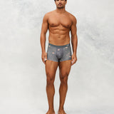 Front photo for a model wearing CottoSilk Galaxy Cotton Trunk in Grey with smooth finish and space print.