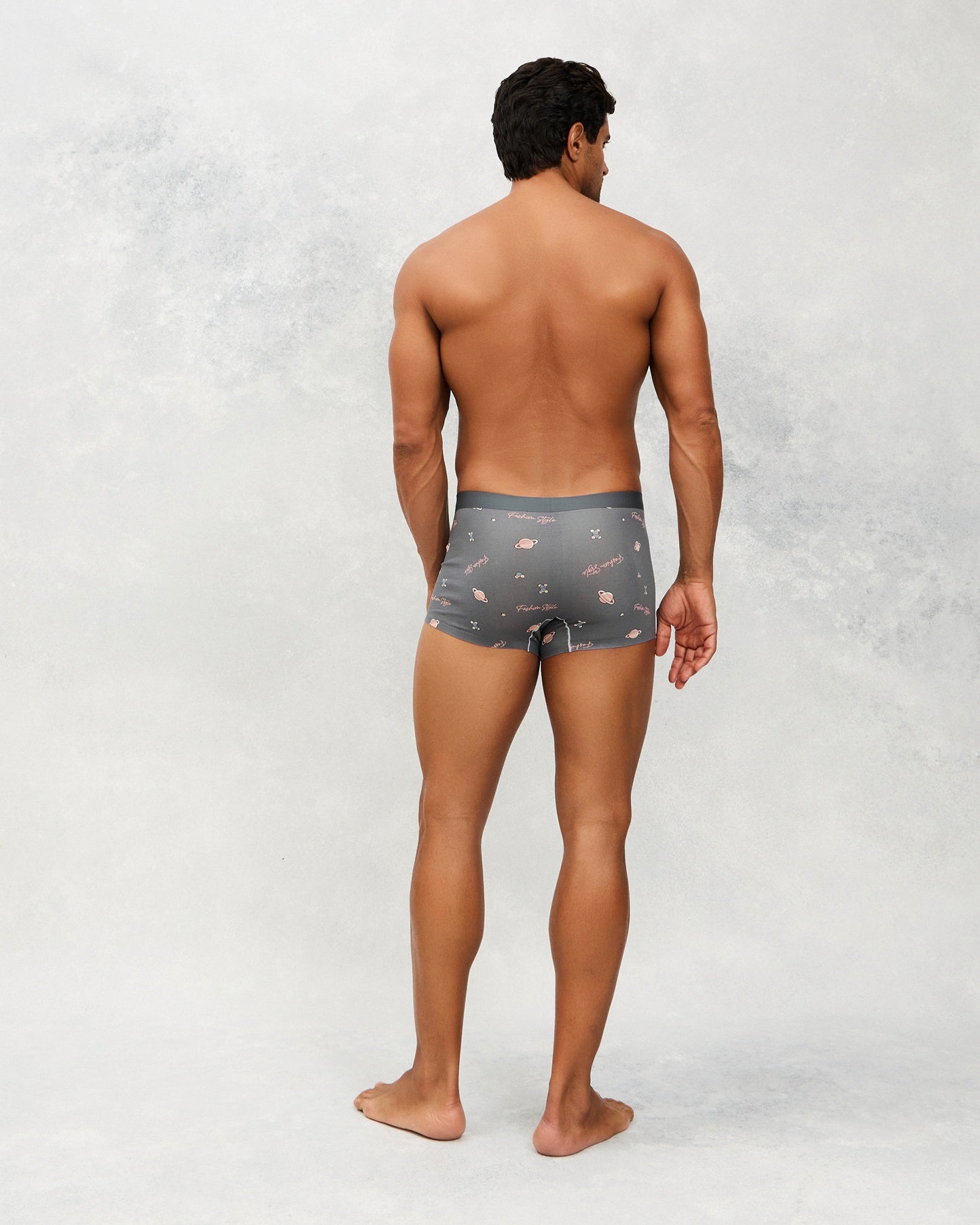 Back photo for a model wearing CottoSilk Galaxy Cotton Trunk in Grey with smooth finish and space print.