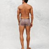 Back photo for a model wearing CottoSilk Galaxy Cotton Trunk in Brown with smooth finish and space print.