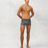 Front photo for a Model wearing Ultra Light Ice Tech Trunk in dark grey.