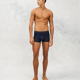 Front photo for a Model wearing Ultra Light Ice Tech Trunk in dark blue.
