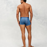 Back photo for a Model wearing Ultra Light Ice Tech Trunk in blue.