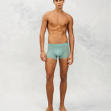 Front photo for a Model wearing Ultra Light Ice Tech Trunk in green.