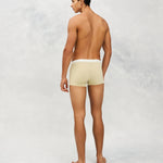 Back photo for a Model wearing Ice Tech Trunk in light yellow.