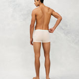 Back photo for a Model wearing Ice Tech Trunk in light orange.