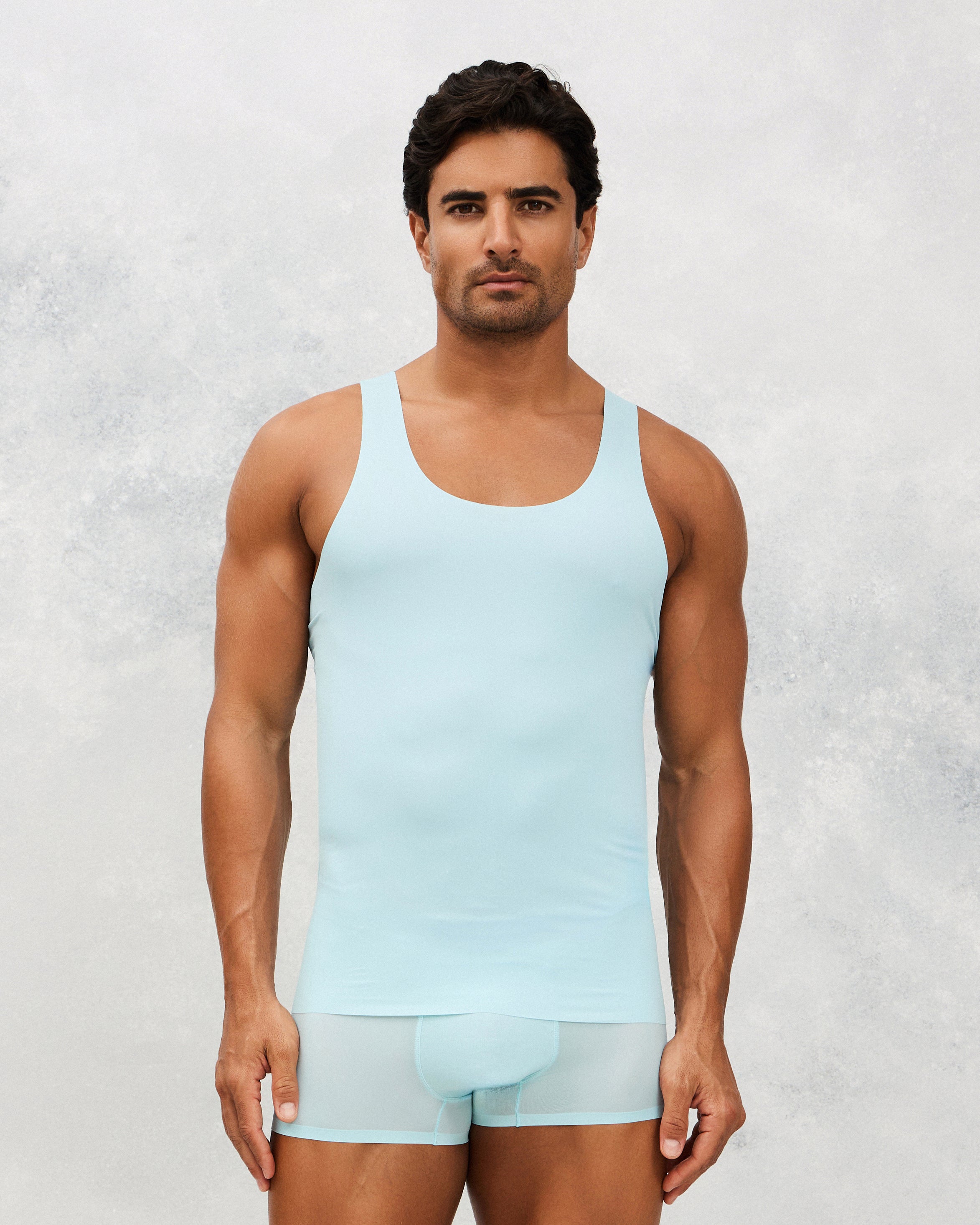 Front photo for a Model wearing Ice Tech Undershirt in baby blue.
