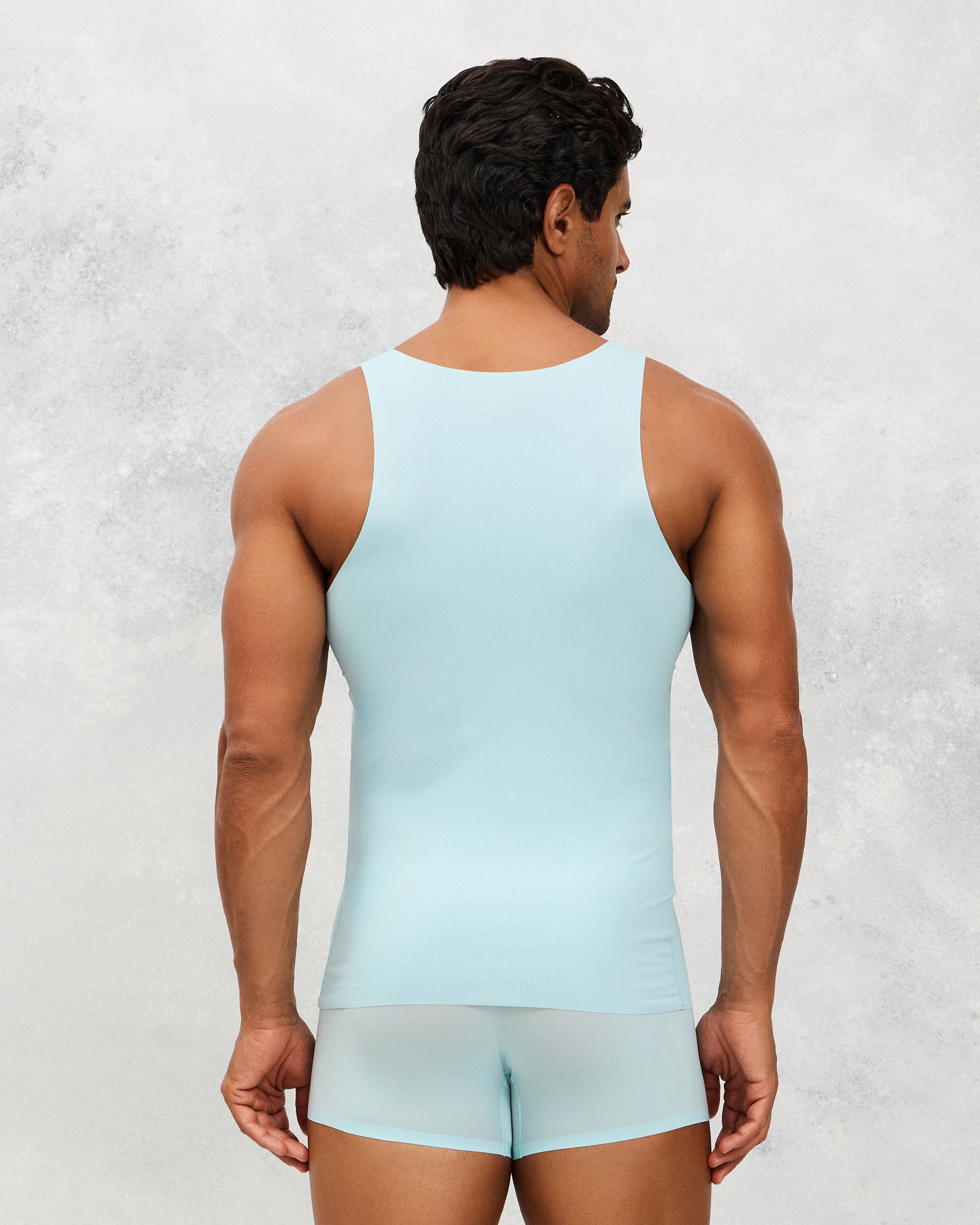 Back photo for a Model wearing Ice Tech Undershirt in baby blue.