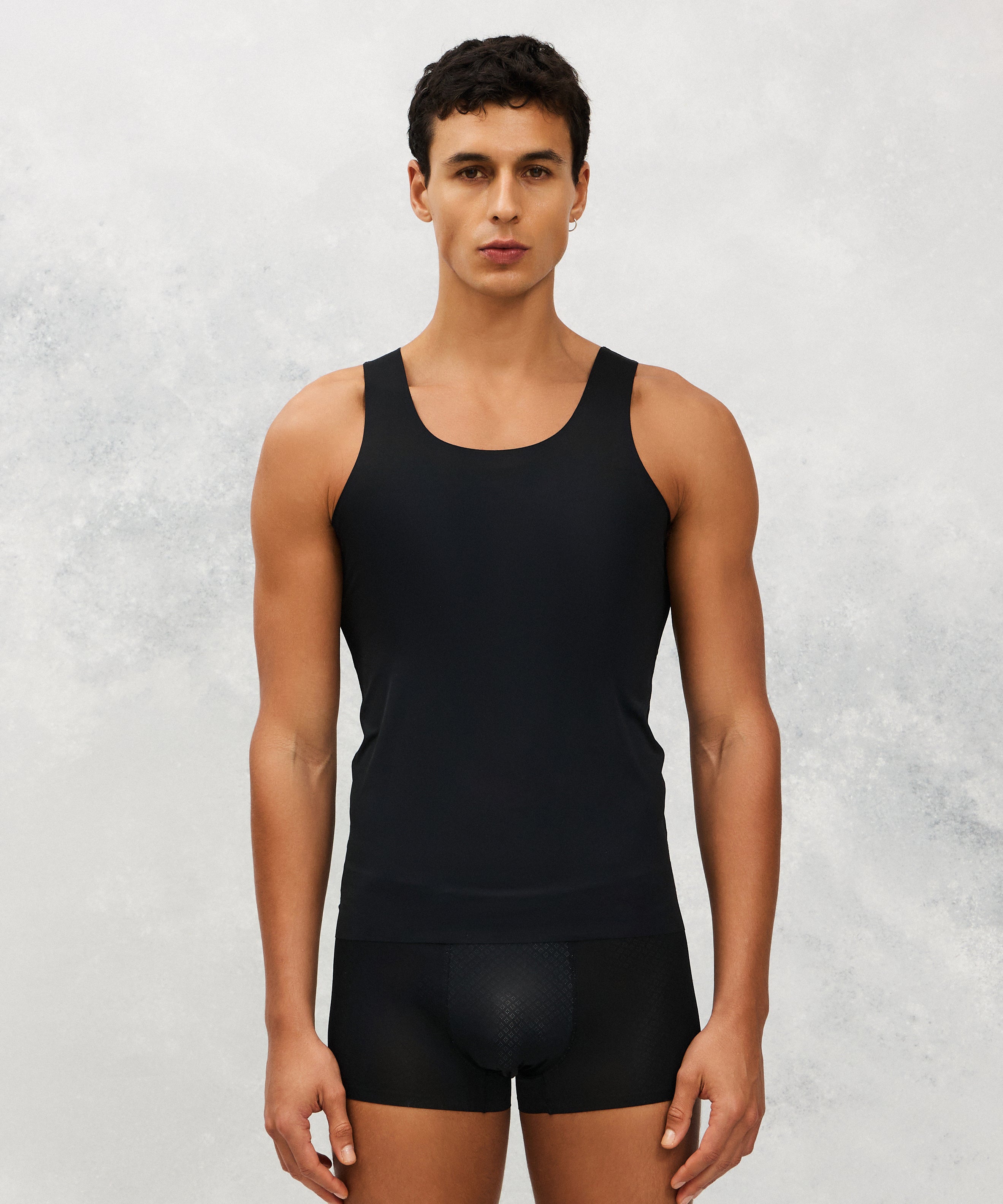 Front photo for a Model wearing Ice Tech Undershirt in black.
