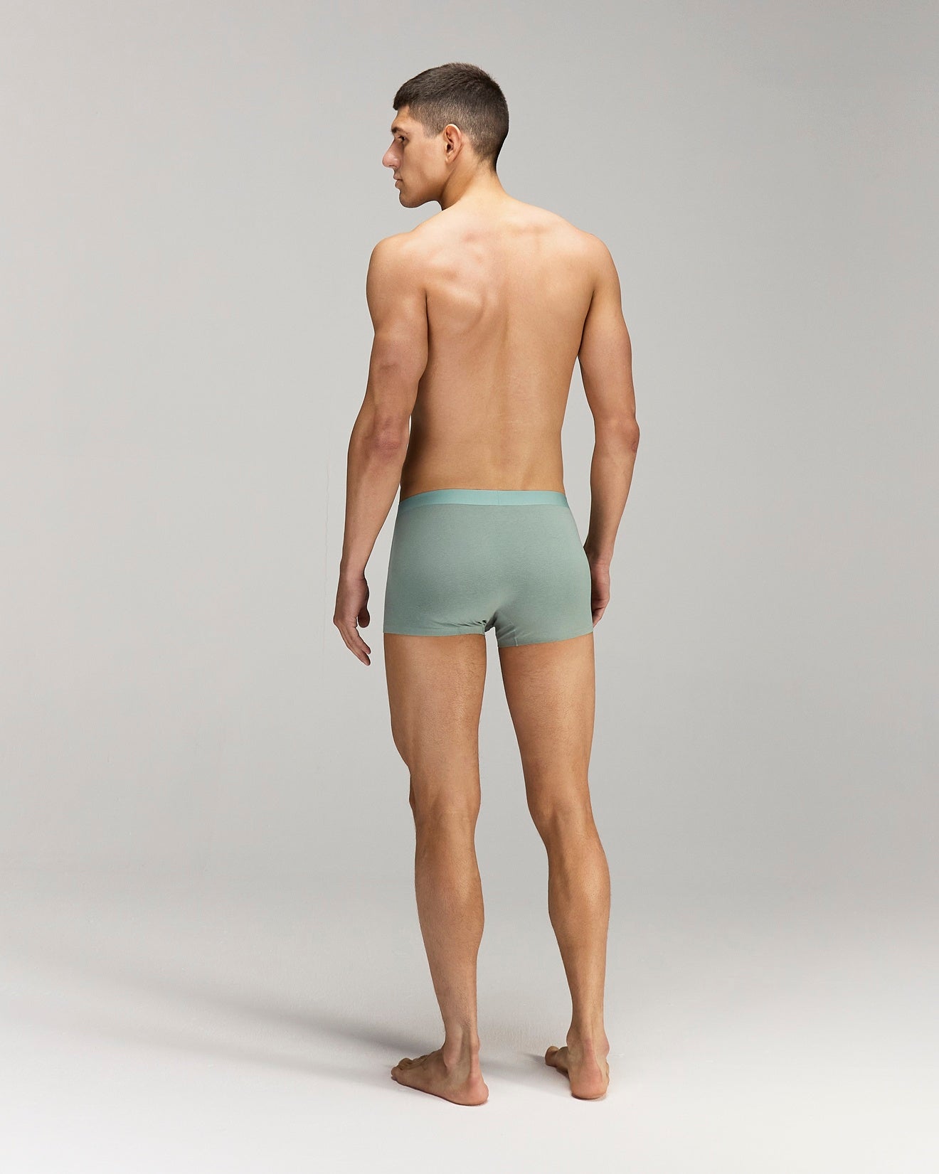 Back photo of Model wearing CottoSilk light Cotton trunk in Green.