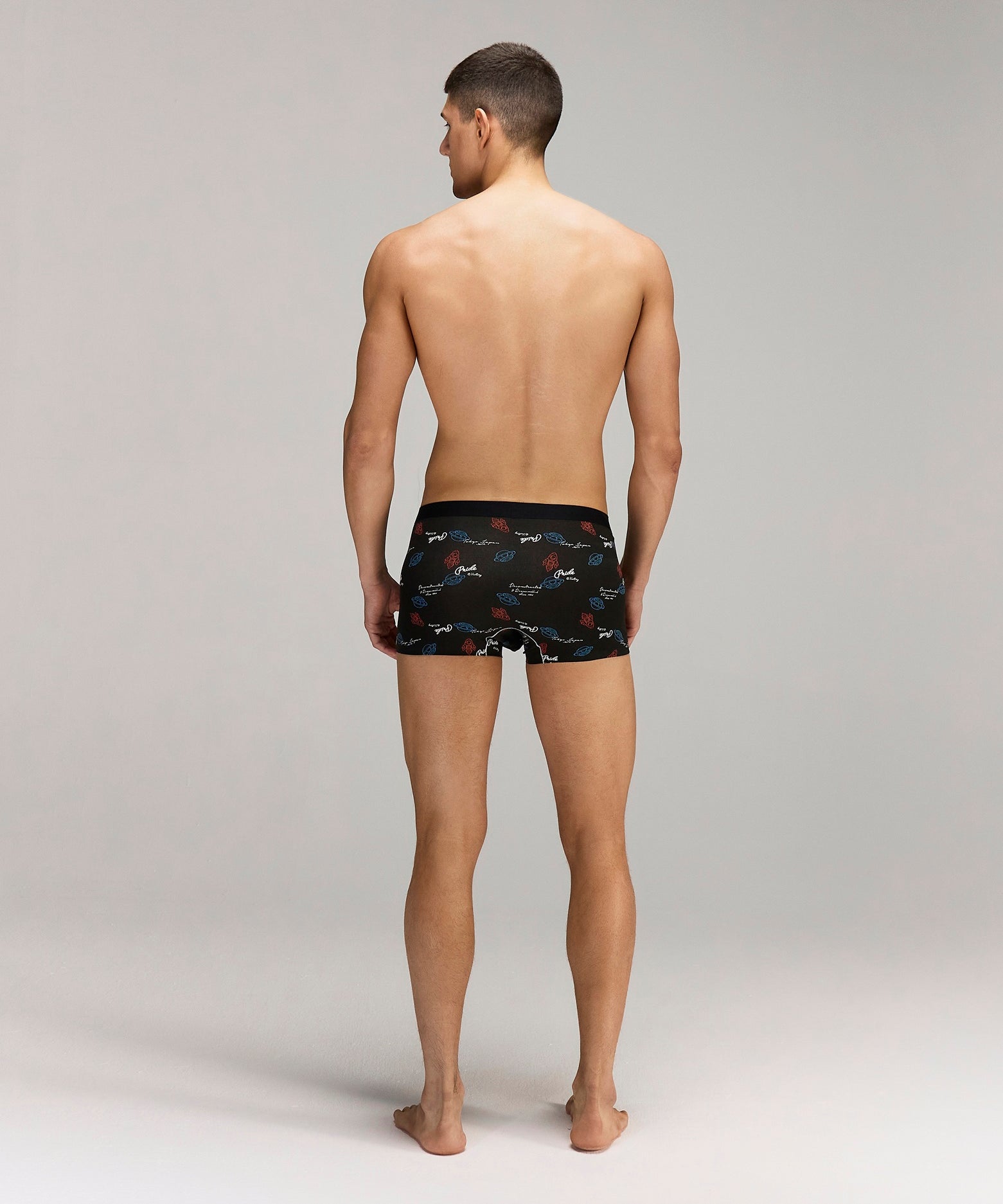 Back photo for a model wearing CottoSilk Galaxy Cotton Trunk in Black with smooth finish and space print.