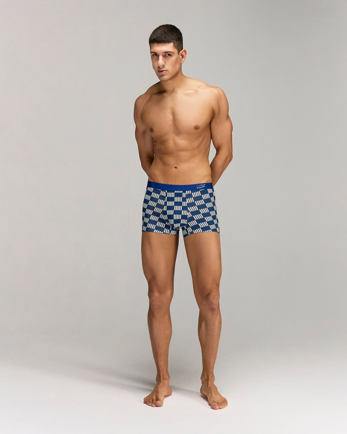 Front photo for a Model wearing Grid Modal Trunk with a geometric pattern in blue.
