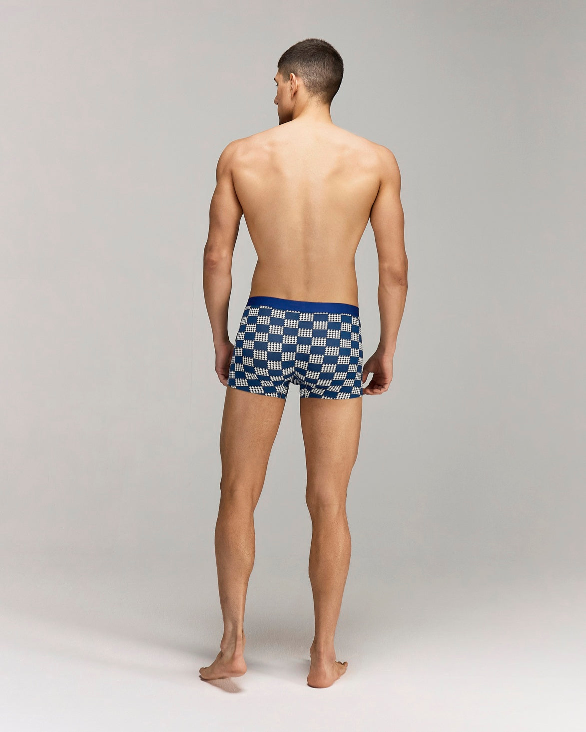 Back photo for a Model wearing Grid Modal Trunk with geometric pattern in blue.