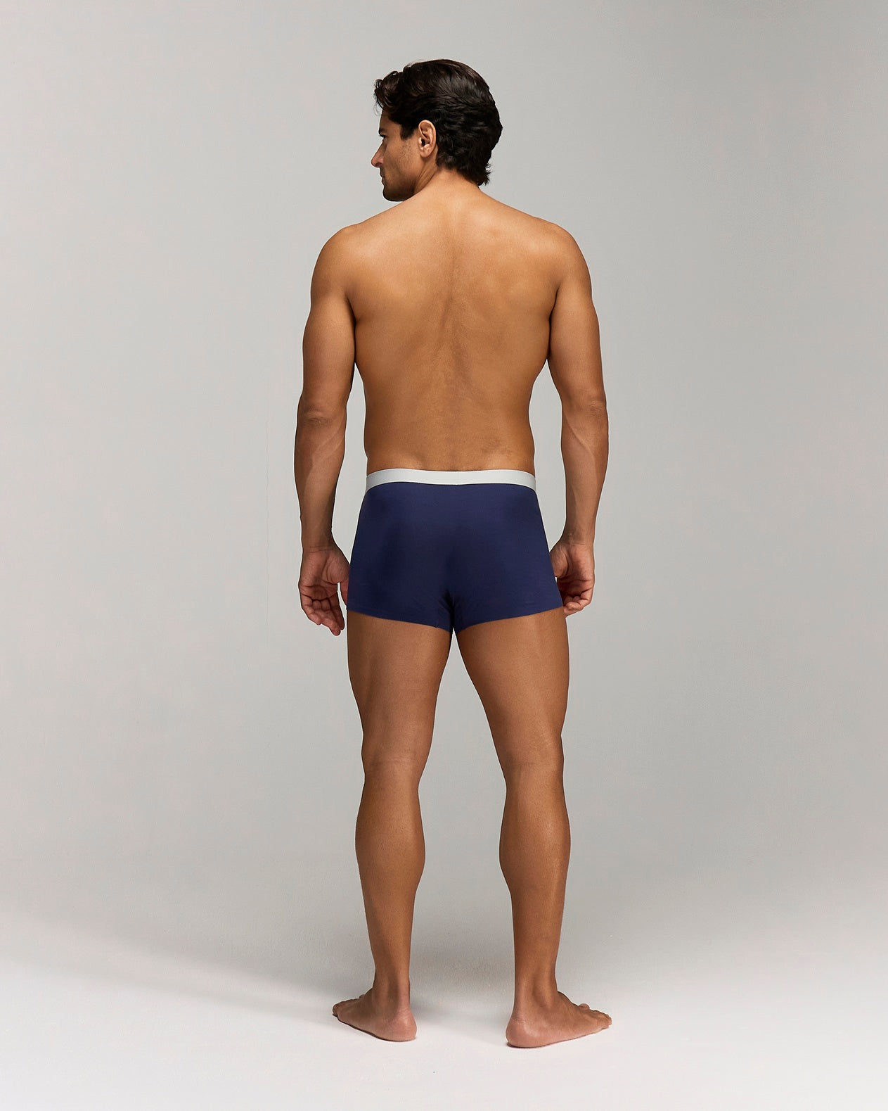 Back photo for a Model wearing Ice Tech Trunk in dark blue.