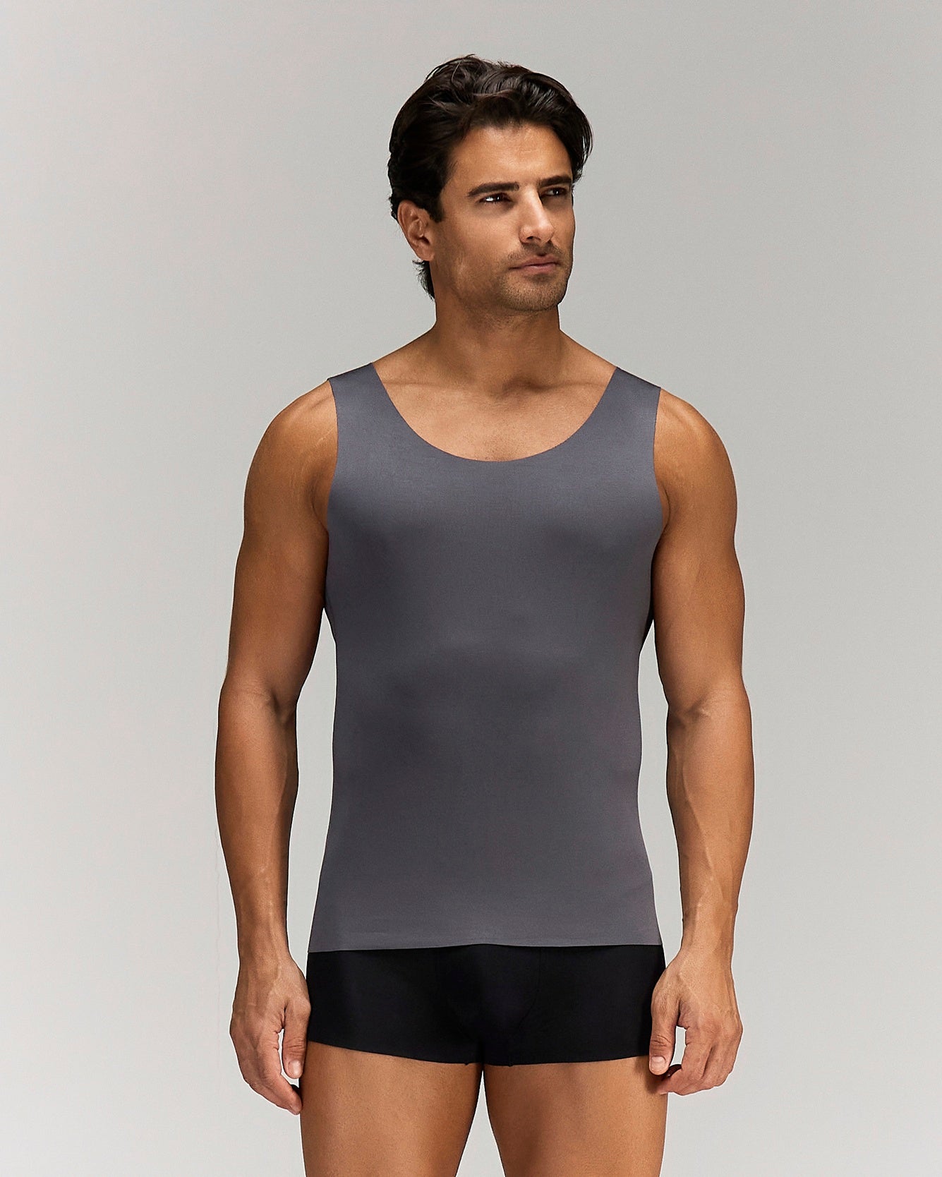 Front photo for a Model wearing Luxury Soft Modal Undershirt with V-neck in dark grey.