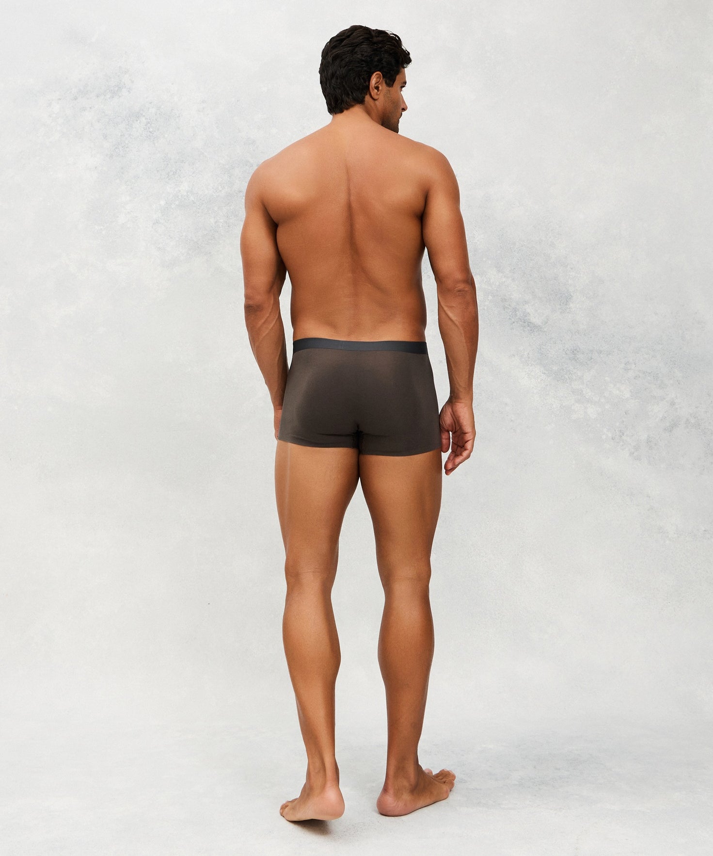 Back photo of Model wearing CottoSilk light Cotton trunk in Dark grey.