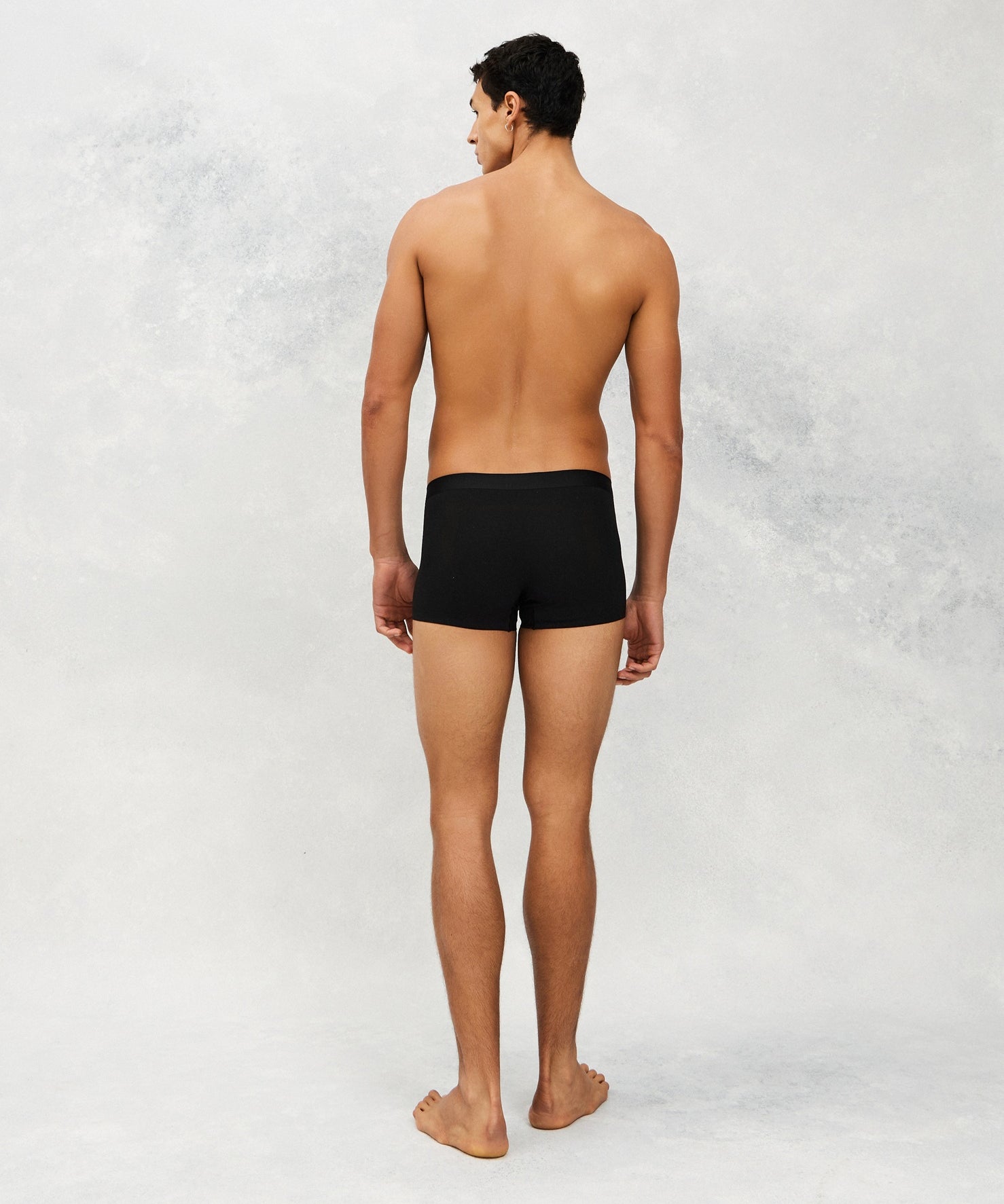 Back photo of Model wearing CottoSilk light Cotton trunk in Black.