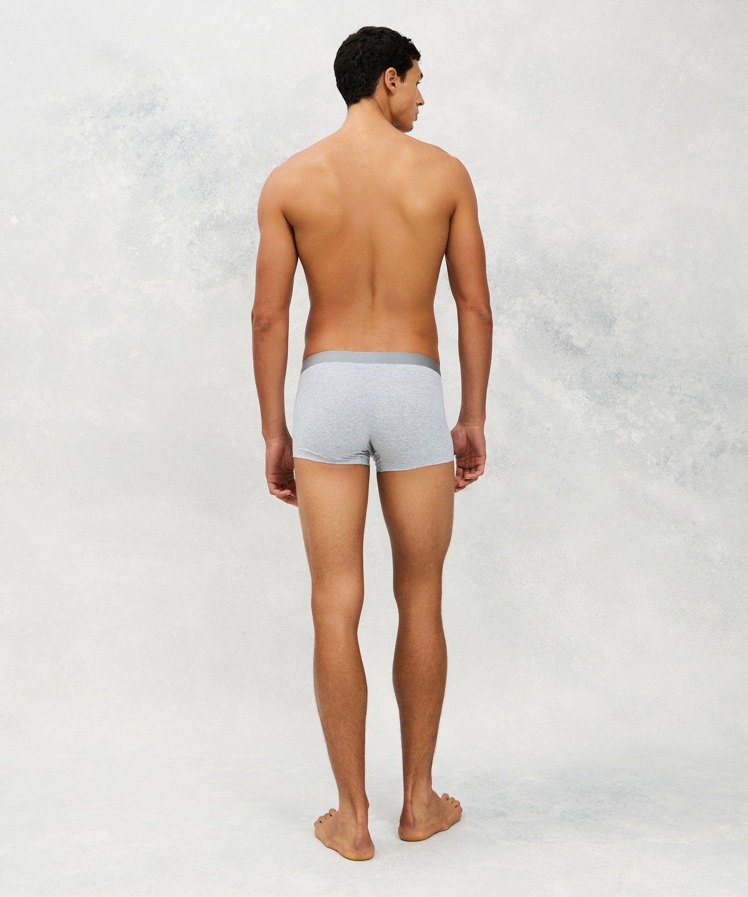 Back photo for a Model wearing CottoSilk Vintage Cotton Trunk in light grey.