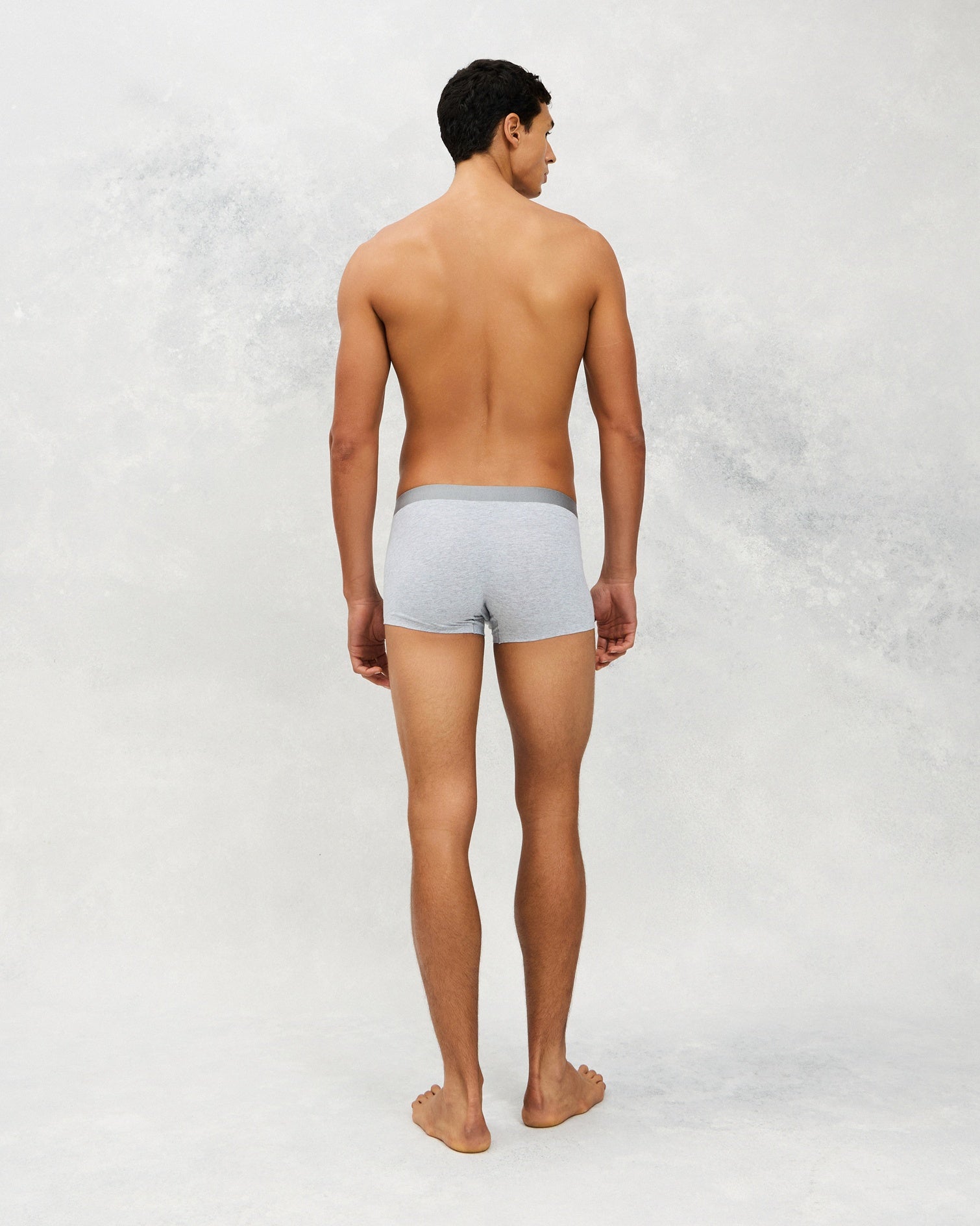 Back photo for a Model wearing CottoSilk Vintage Cotton Trunk in light grey.