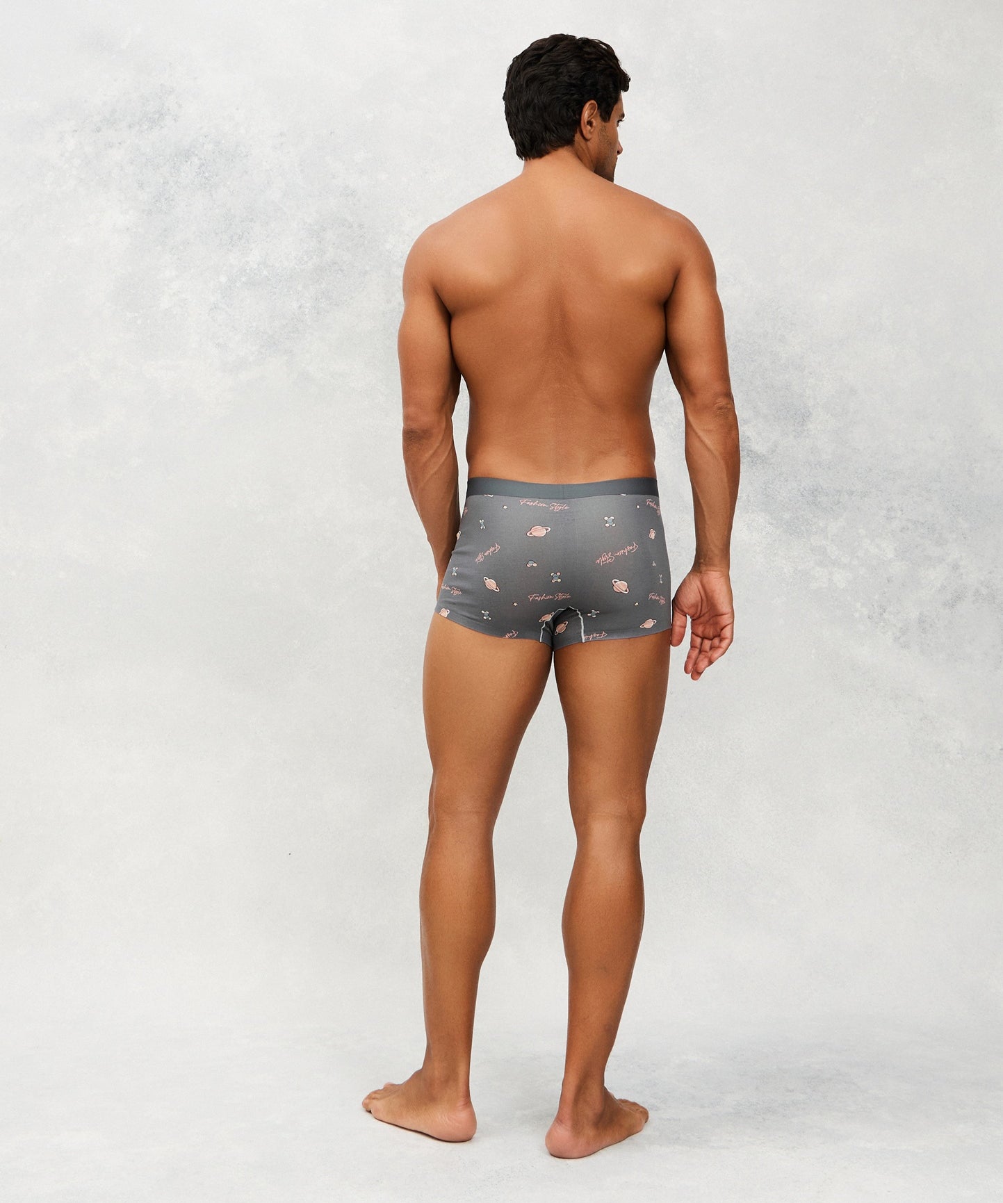 Back photo for a model wearing CottoSilk Galaxy Cotton Trunk in Grey with smooth finish and space print.