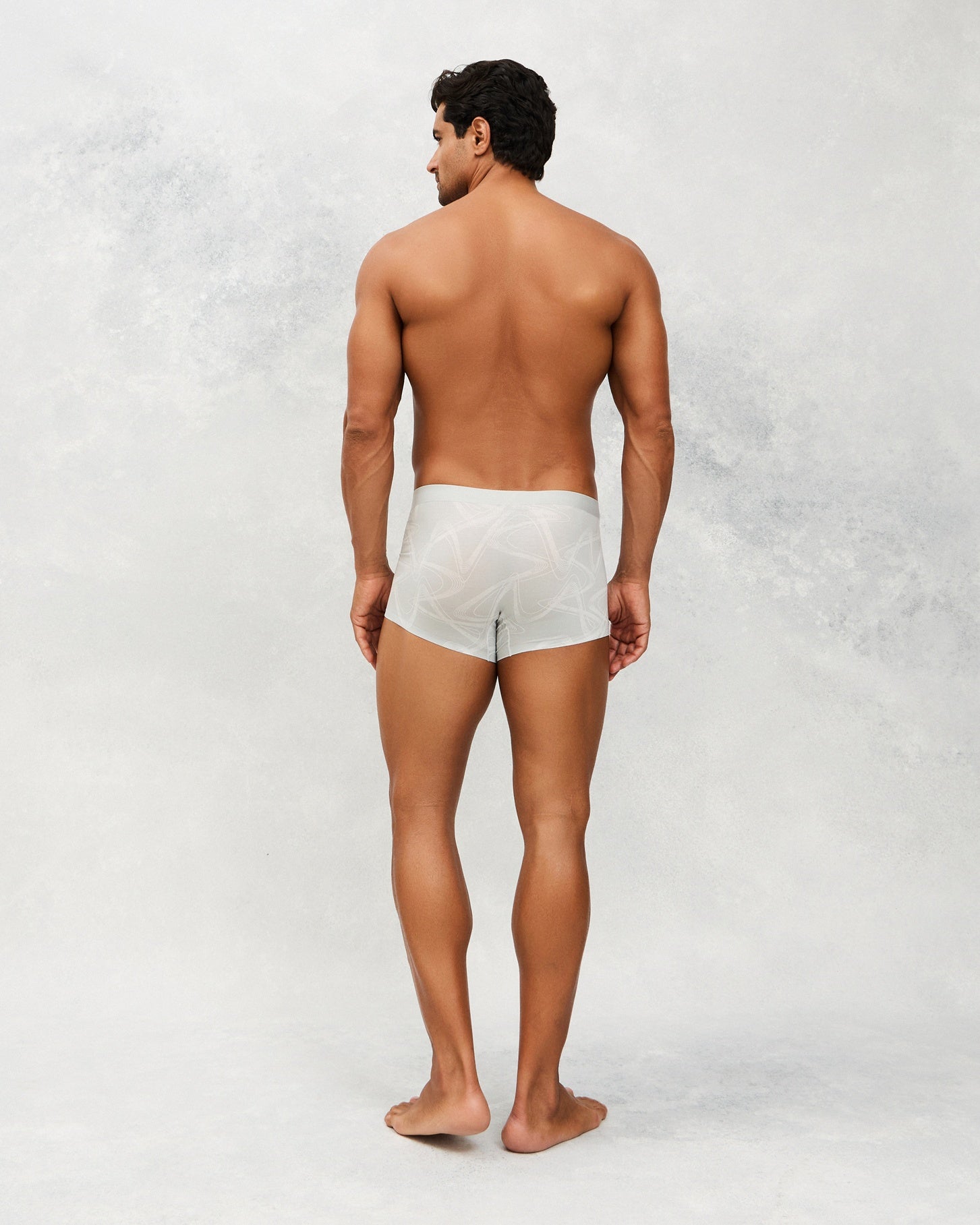 Back photo for a Model wearing CS Streak Modal Trunk in light grey.