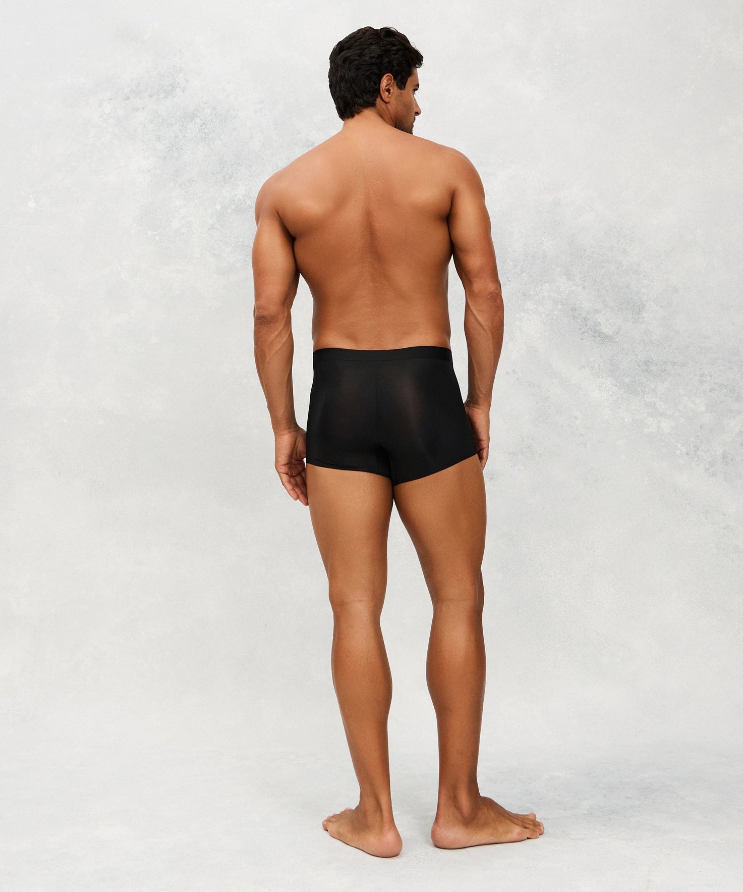 Back photo for a Model wearing Ultra Light Ice Tech Trunk in black.