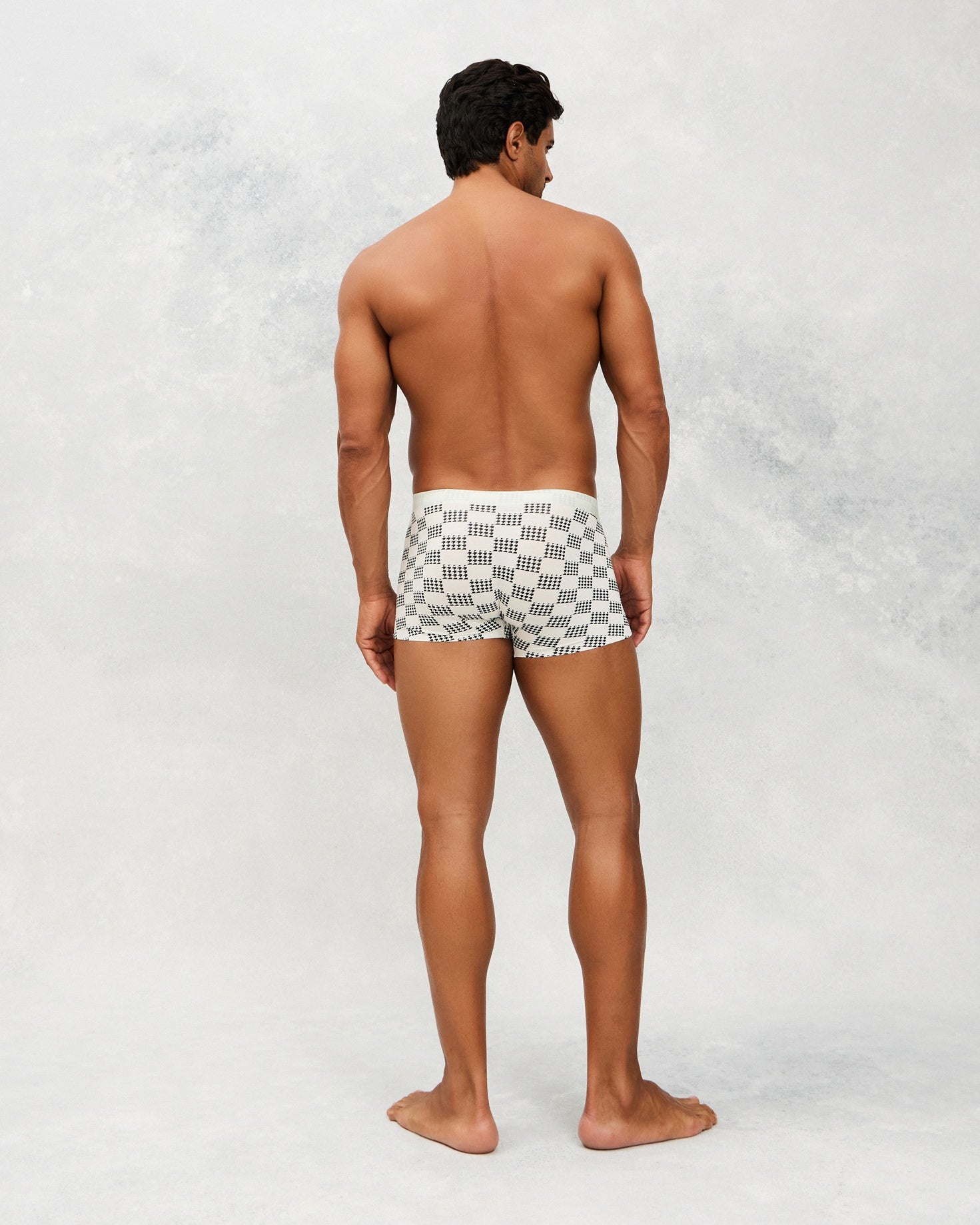 Back photo for a Model wearing Grid Modal Trunk with geometric pattern in light grey.
