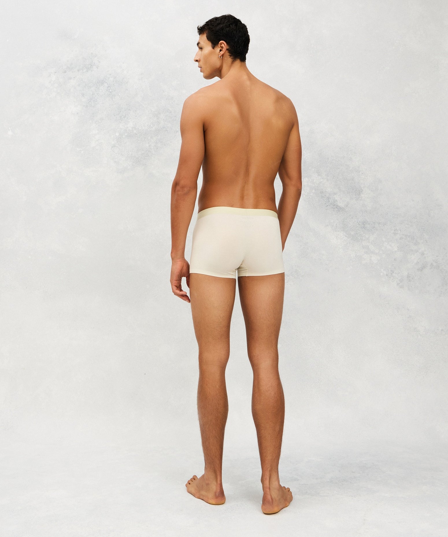 Back photo for a Model wearing Ice Tech Trunk in light green.