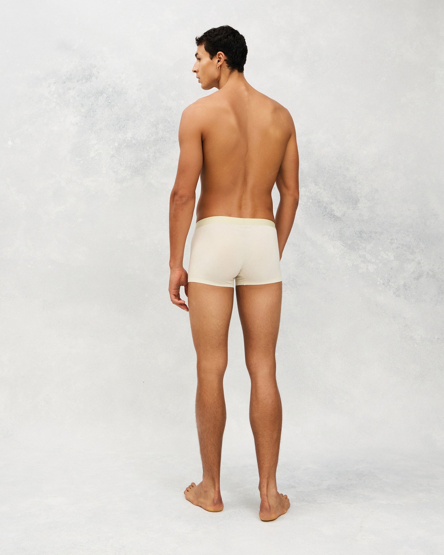 Back photo for a Model wearing Ice Tech Trunk in light green.