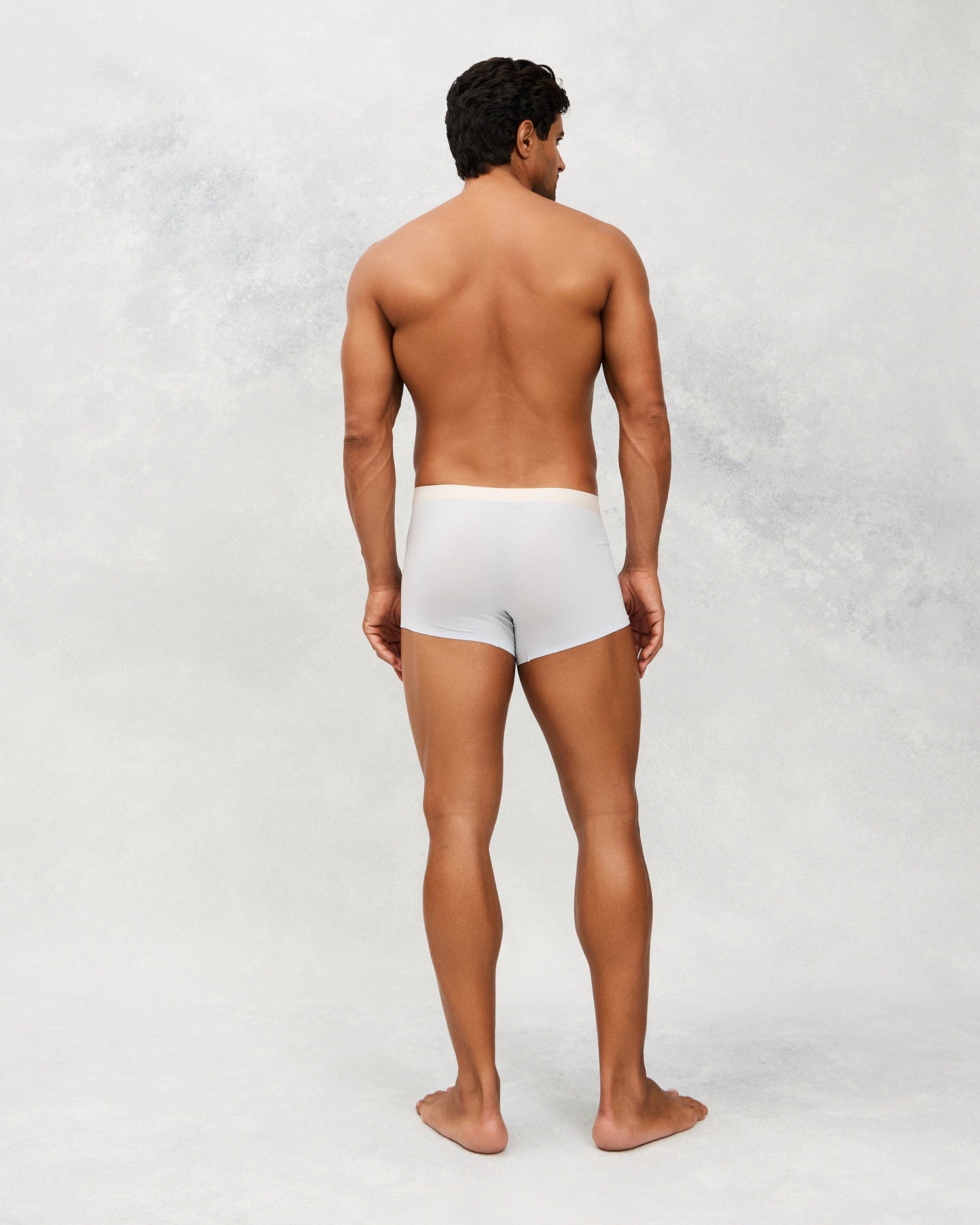 Back photo for a Model wearing Ice Tech Trunk in light blue.