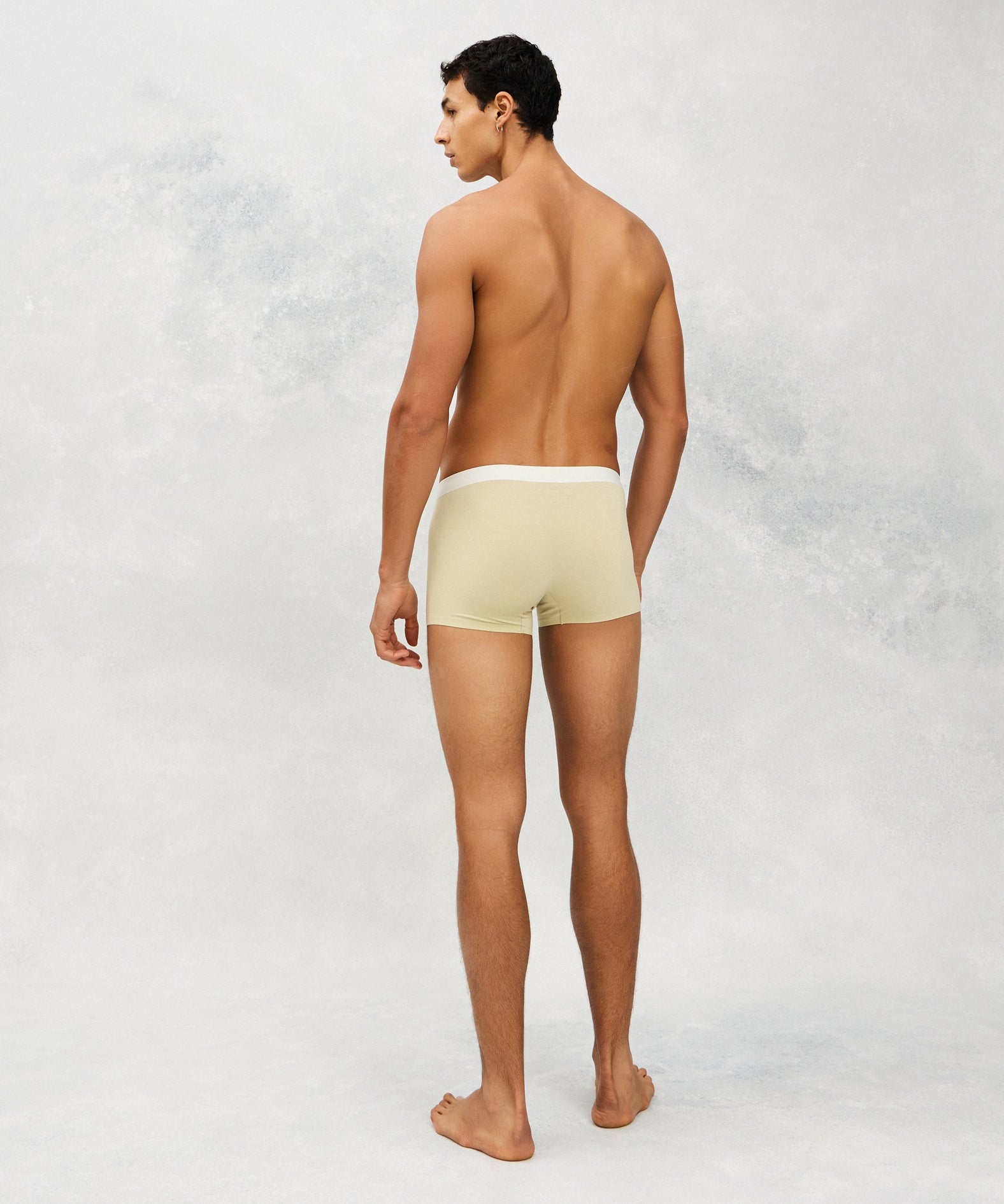 Back photo for a Model wearing Ice Tech Trunk in light yellow.