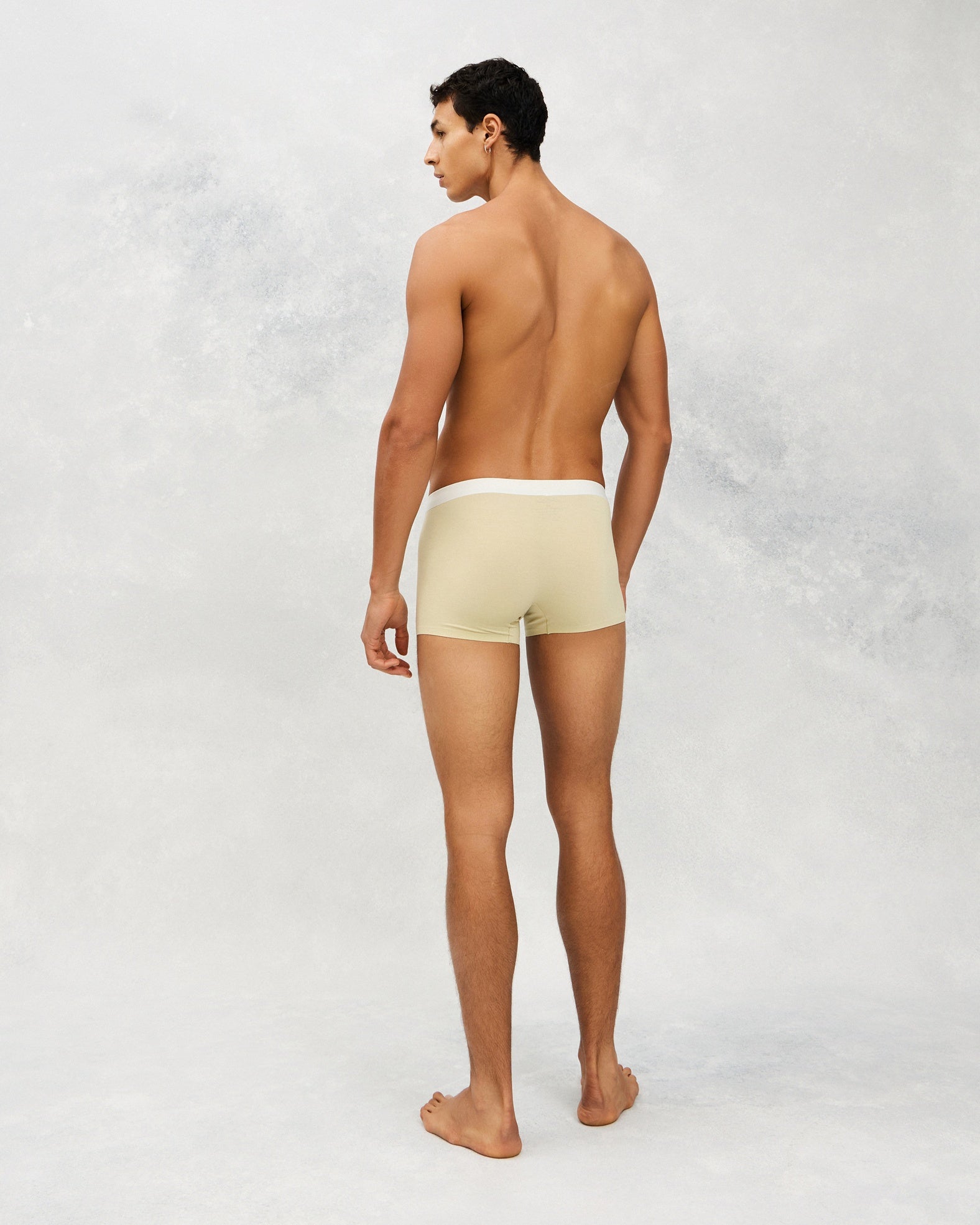 Back photo for a Model wearing Ice Tech Trunk in light yellow.
