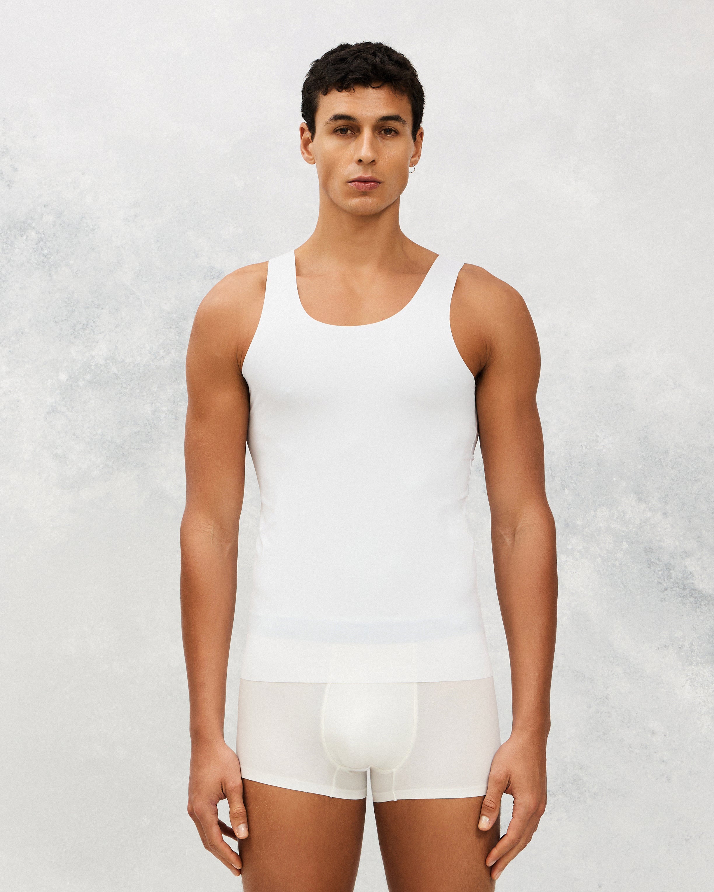 Front photo for a Model wearing Ice Tech Undershirt in white.