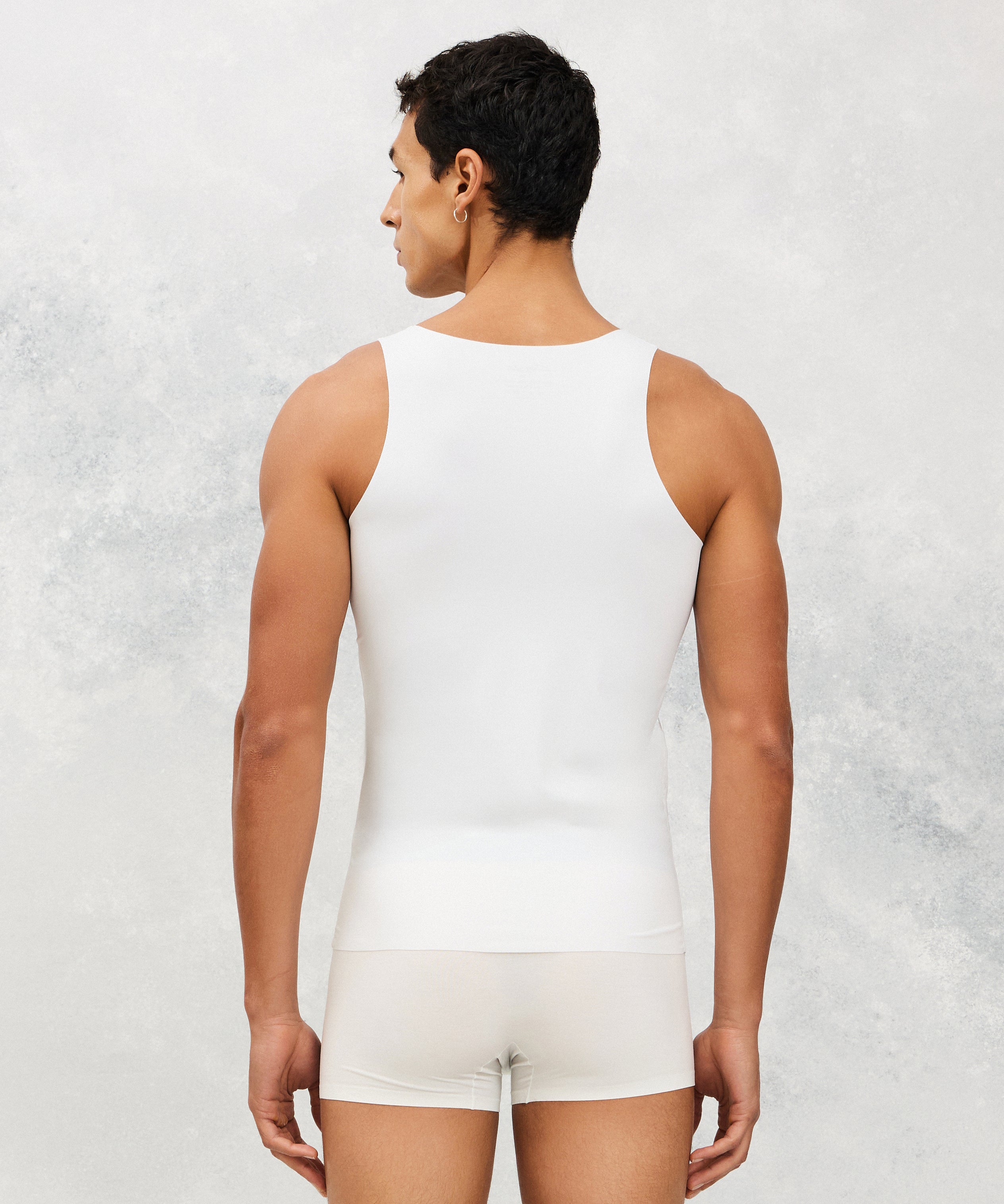 Back photo for a Model wearing Ice Tech Undershirt in white.