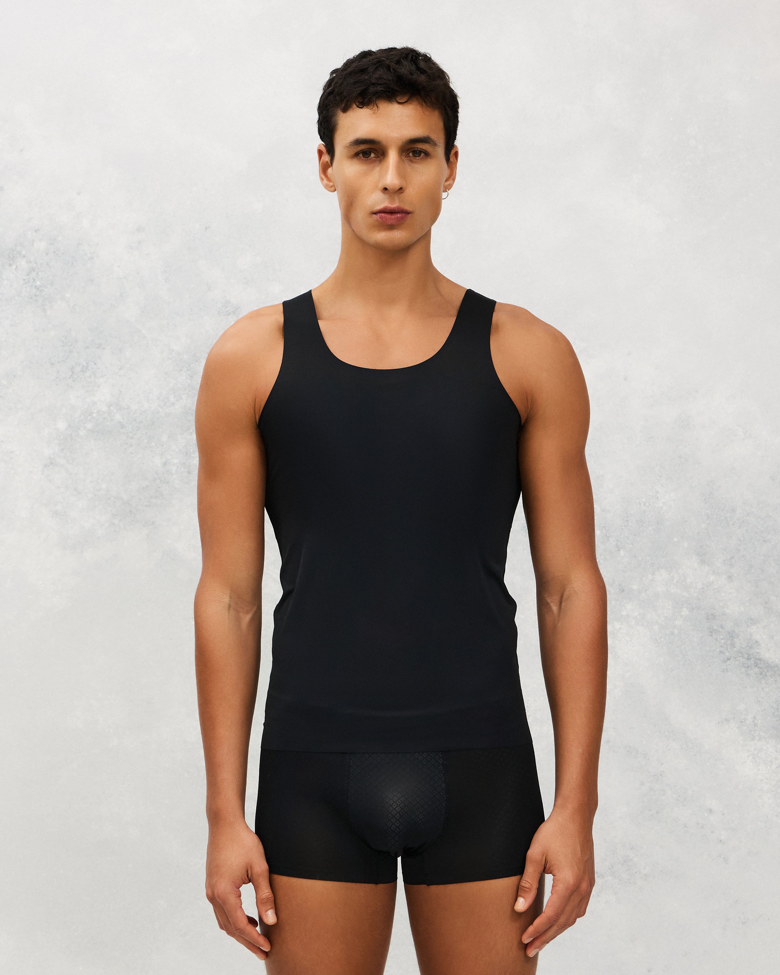 Front photo for a Model wearing Ice Tech Undershirt in black.