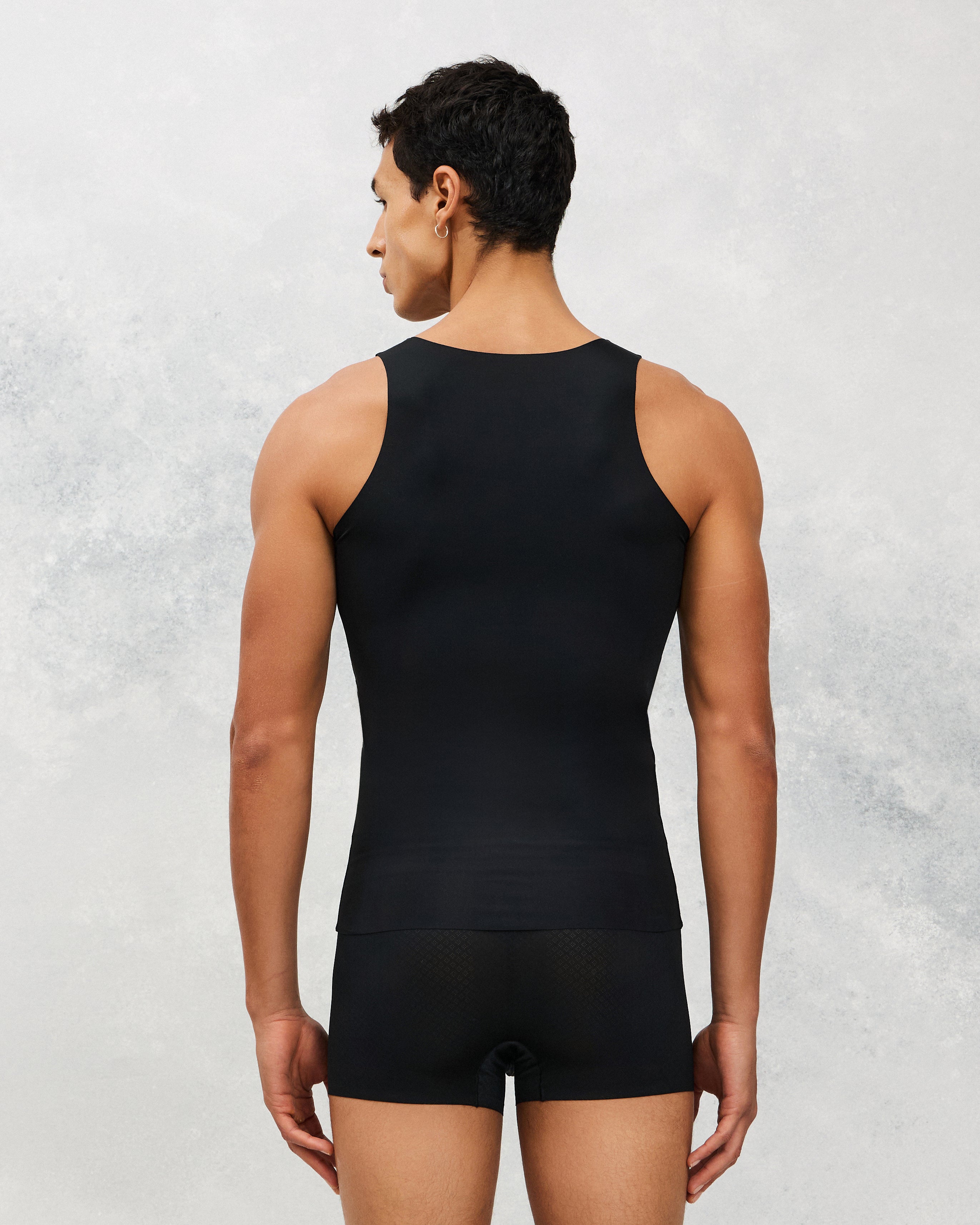 Back photo for a Model wearing Ice Tech Undershirt in black.