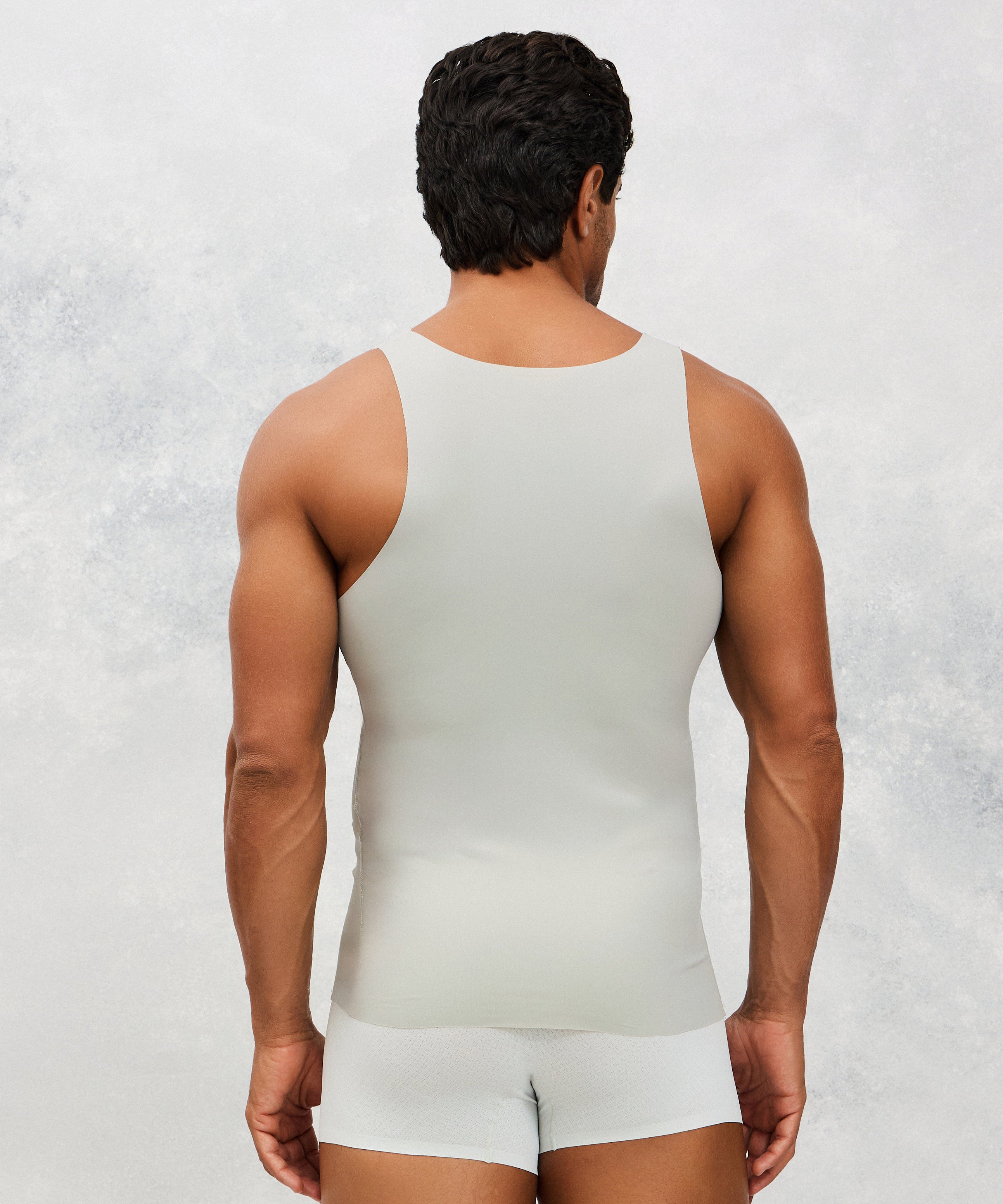 Back photo for a Model wearing Ice Tech Undershirt in grey.