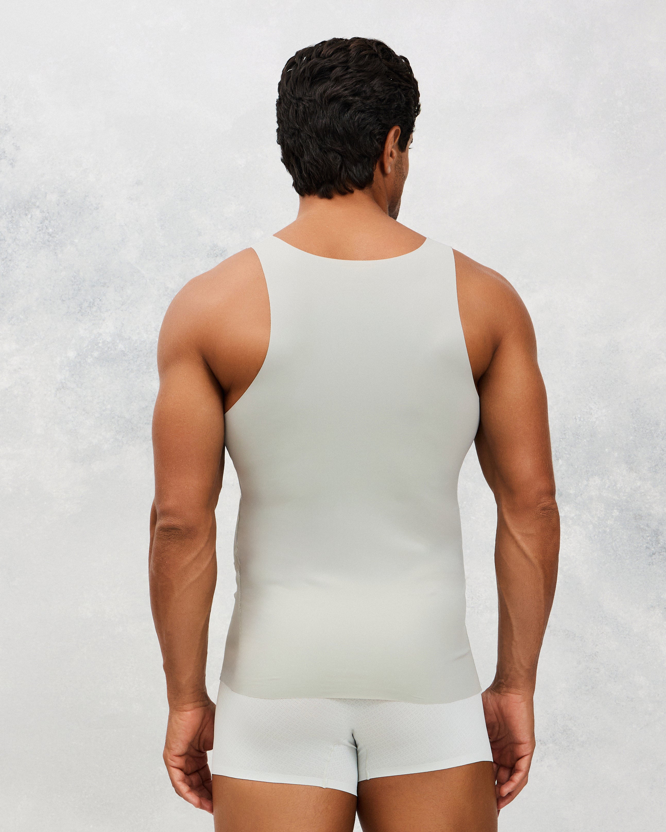 Back photo for a Model wearing Ice Tech Undershirt in grey.
