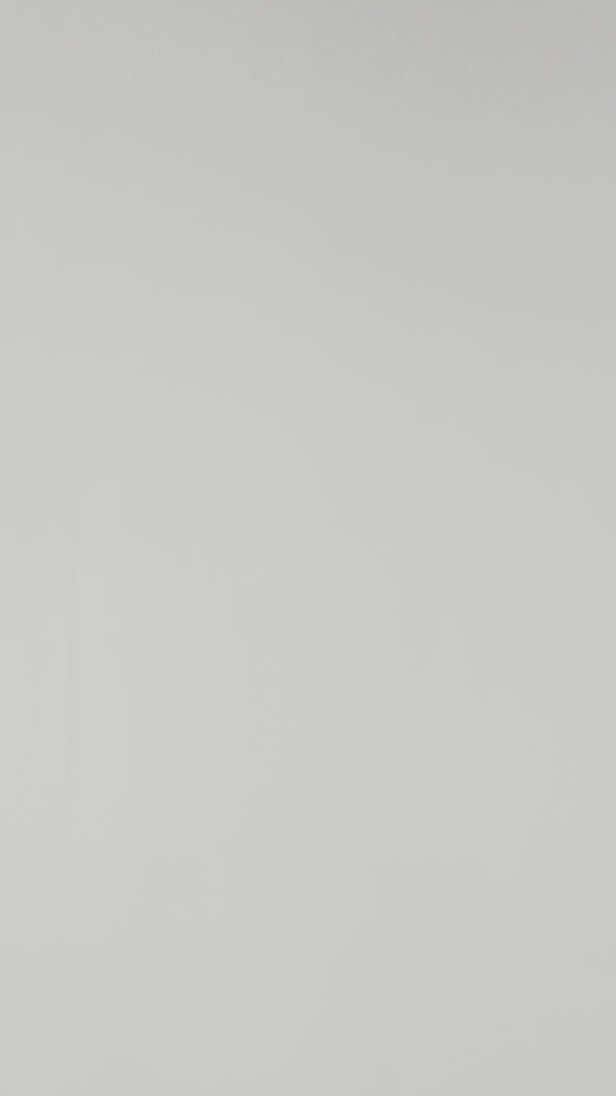 A model wearing Luxury Soft Modal Undershirt with V-neck in black showing its details and laser cut finish.